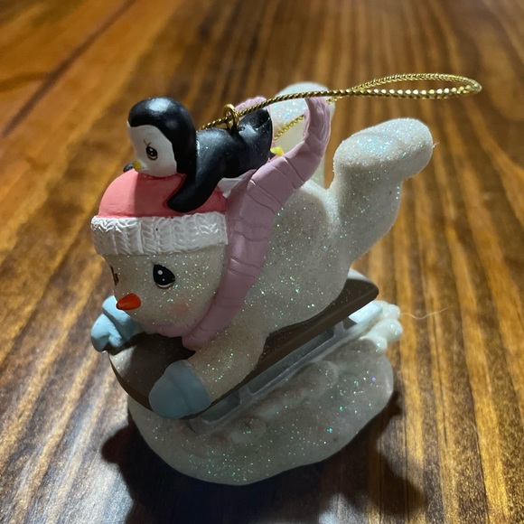 Vintage child snowman sledding snowman with baby penguin ornament. - Picture 2 of 4